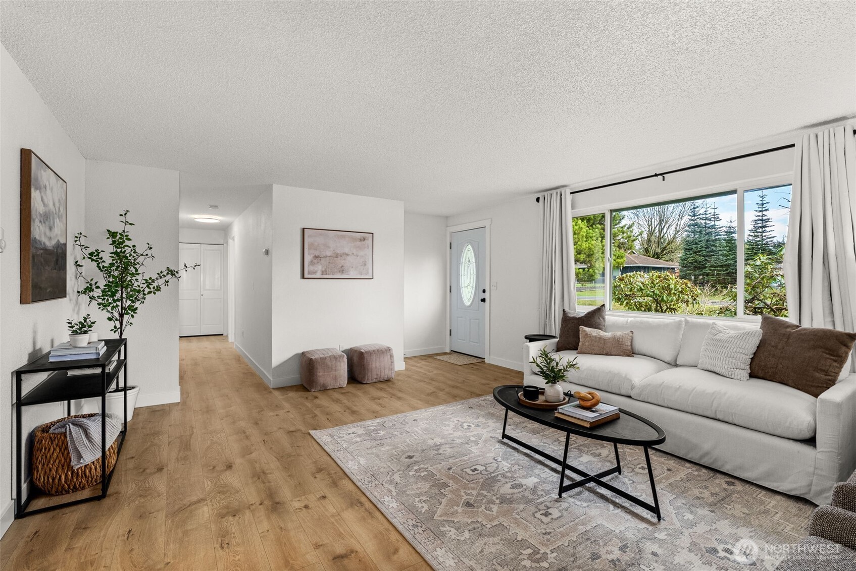18821 Guava Street Southwest Rochester, WA 98579 - Photo 4 of 28 a living room with furniture and a large window