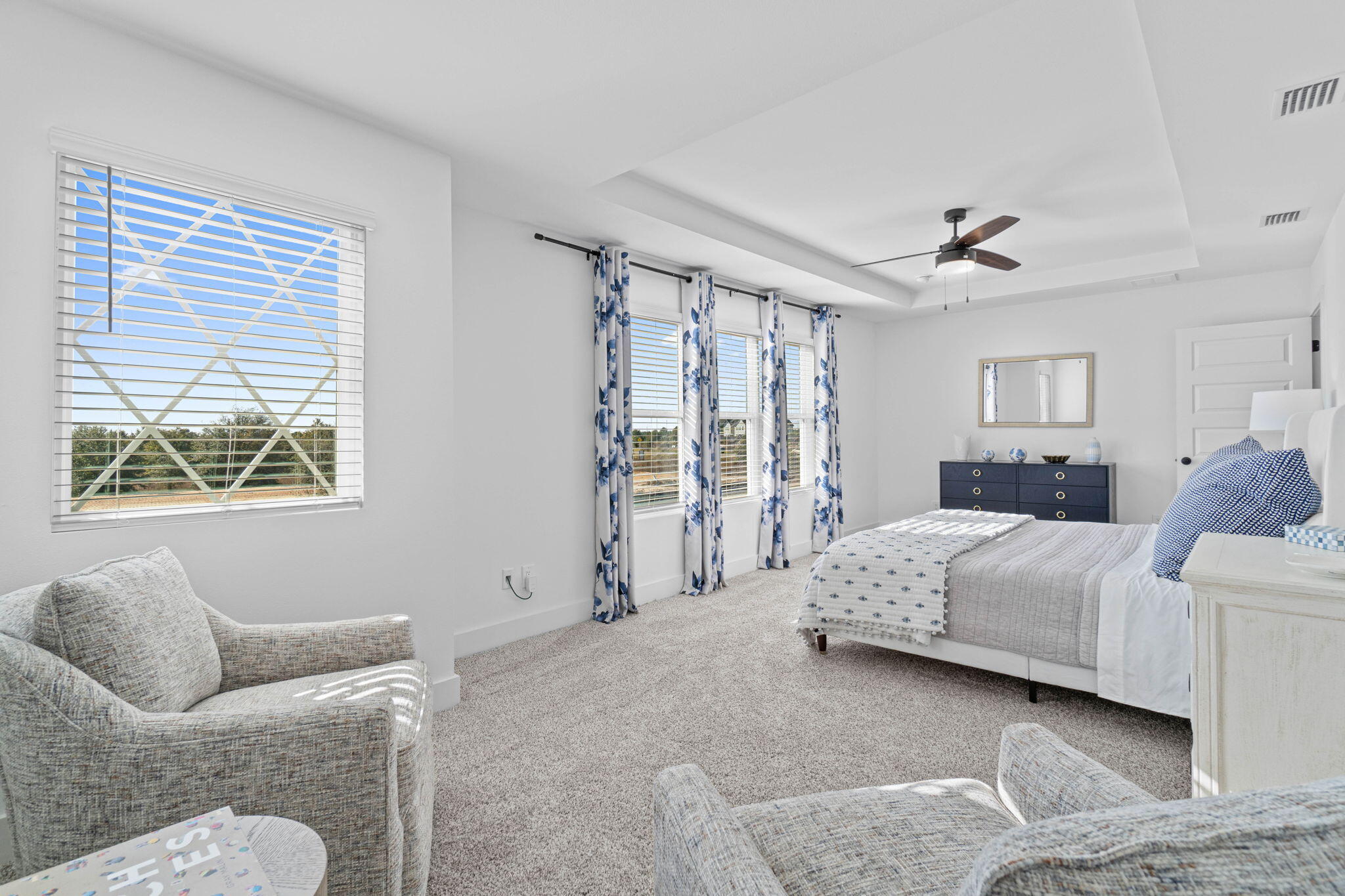 41 Sweetclover Street Freeport, FL 32439 - Photo 24 of 35 a spacious bedroom with a bed and glass window