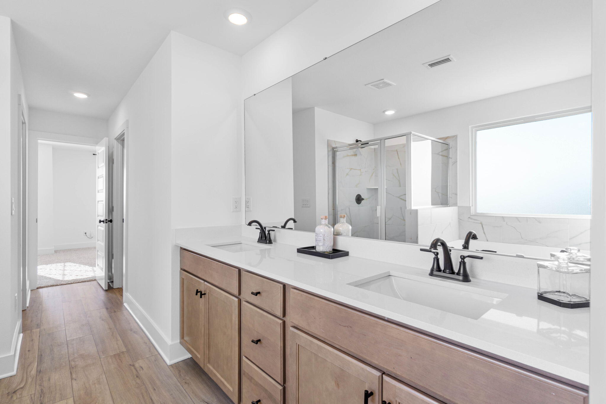 41 Sweetclover Street Freeport, FL 32439 - Photo 26 of 35 a bathroom with a double vanity sink and mirror