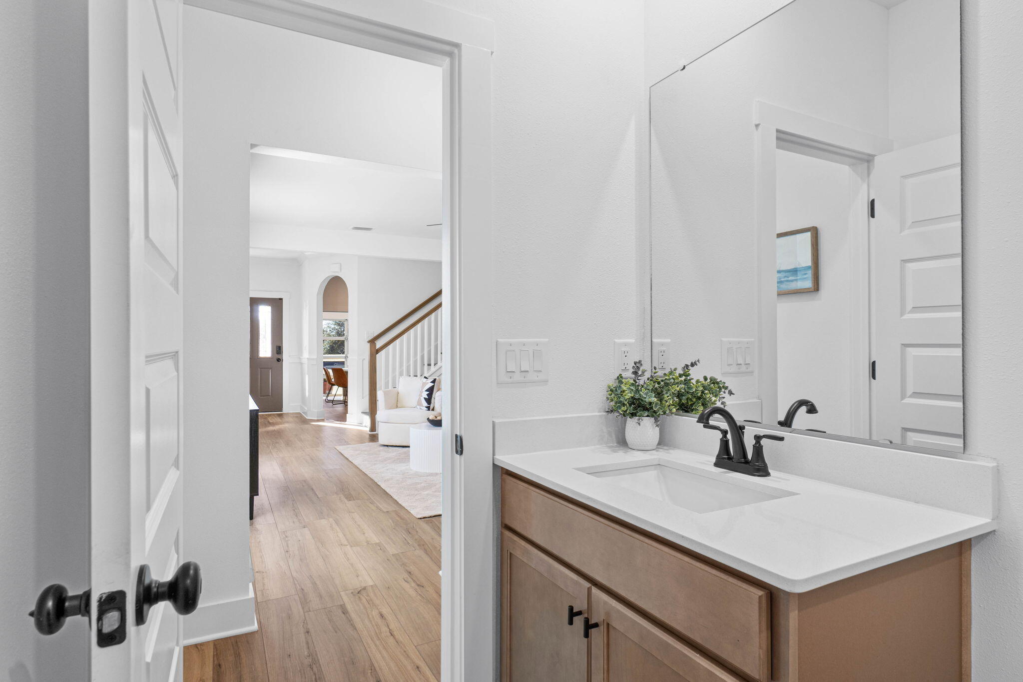 41 Sweetclover Street Freeport, FL 32439 - Photo 10 of 35 a bathroom with a sink and a mirror