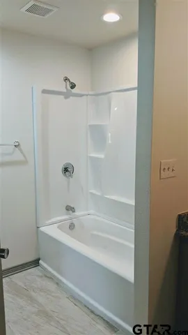 a bathroom with a bathtub
