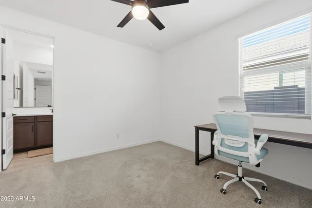 a kitchen with stainless steel appliances a refrigerator stove microwave and cabinets with wooden floor