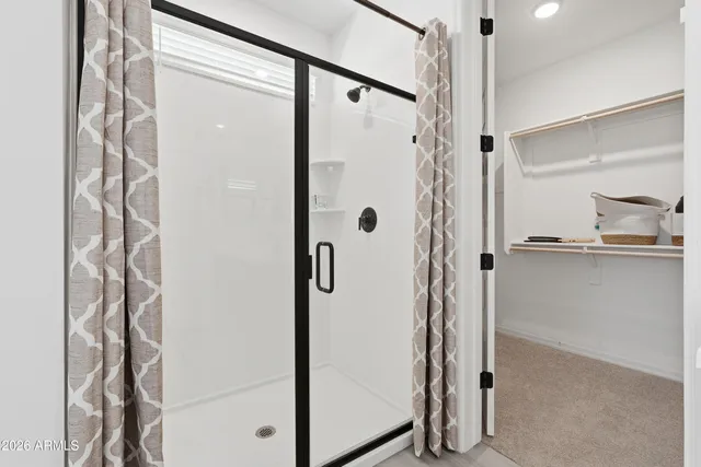 an empty room with a ceiling fan