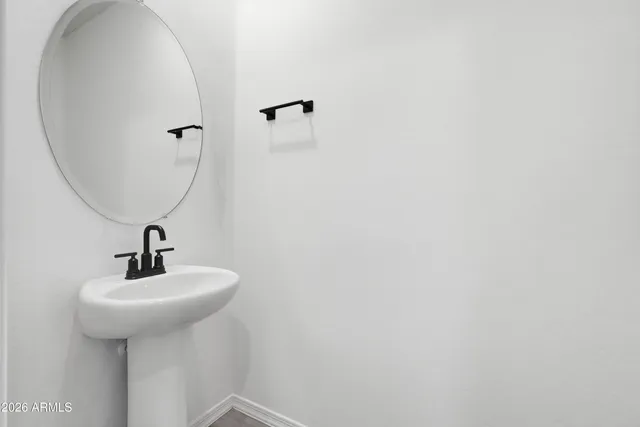 a bathroom with a shower and a glass door