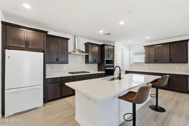 a view of kitchen with furniture and wooden floor