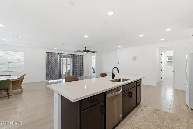 a kitchen with a table and chairs in it