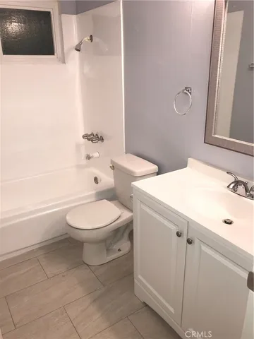a bathroom with a toilet a sink and a bathtub