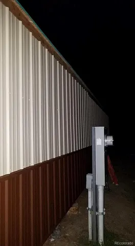 a wooden fence with some trees in the background