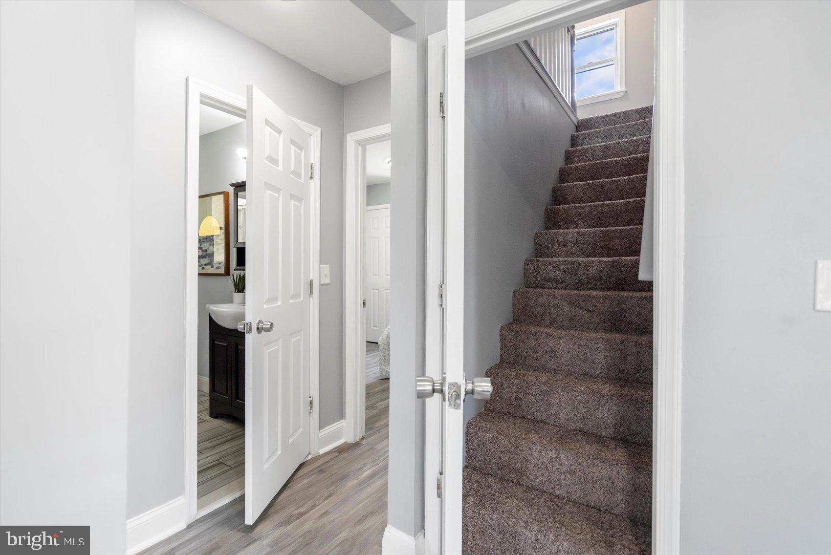 6628 Hartwait Street Baltimore, MD 21224 - Photo 15 of 31 a view of a hallway with wooden floor and entryway