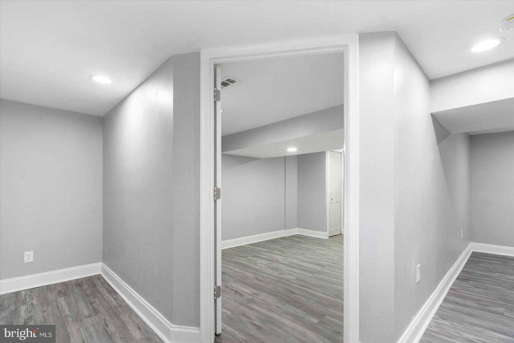 6628 Hartwait Street Baltimore, MD 21224 - Photo 21 of 31 a view of hallway with wooden floor