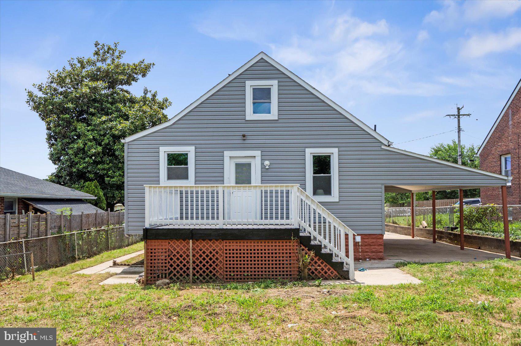 6628 Hartwait Street Baltimore, MD 21224 - Photo 27 of 31 a front view of a house with a yard