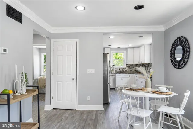 a view of a kitchen and dining room