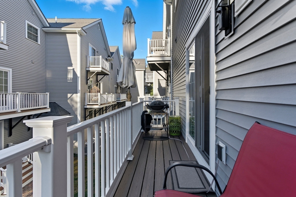 66 Compass Point, Unit 66 North Andover, MA 01845 - Photo 17 of 42 a view of balcony with wooden floor