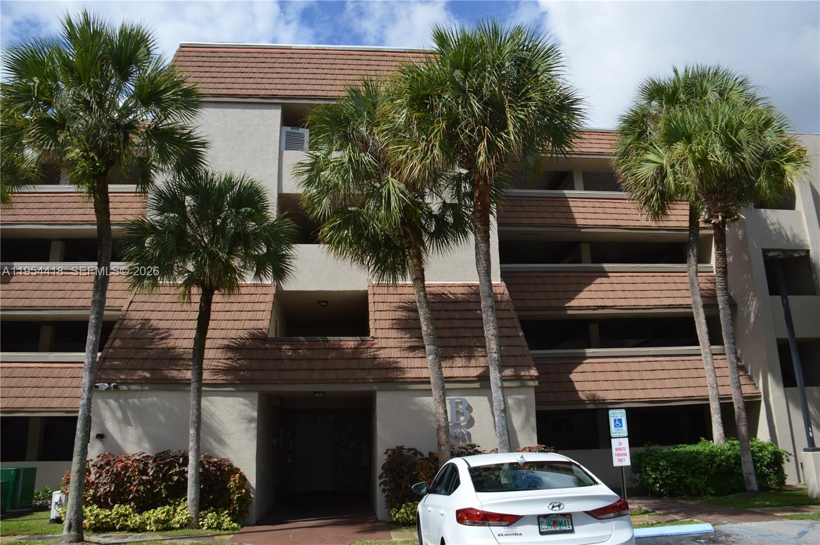 461 Ives Dairy Road, Unit 4042 Miami, FL 33179 - Photo 12 of 20 a car parked in front of a house