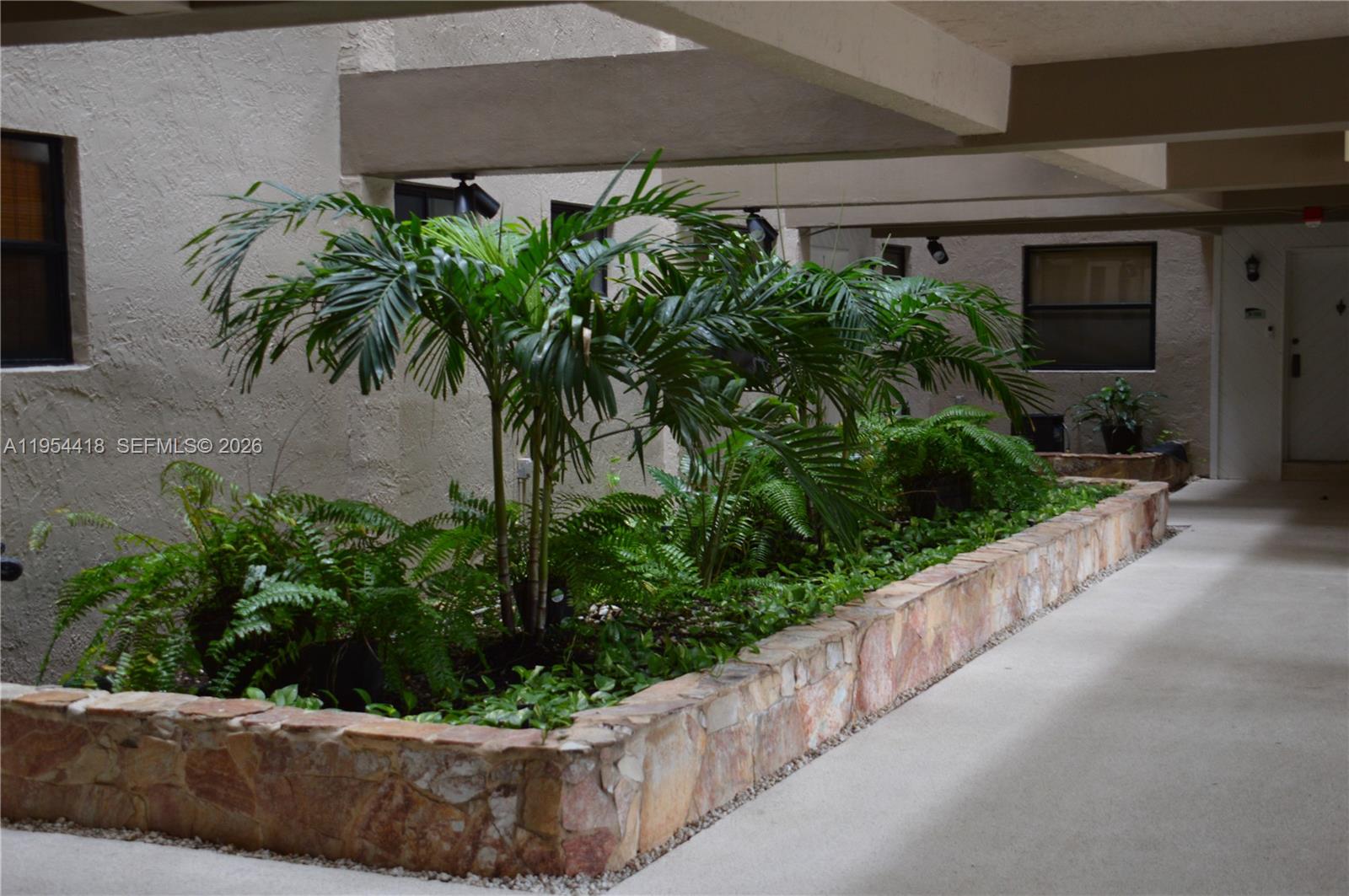 461 Ives Dairy Road, Unit 4042 Miami, FL 33179 - Photo 13 of 20 a view of a garden