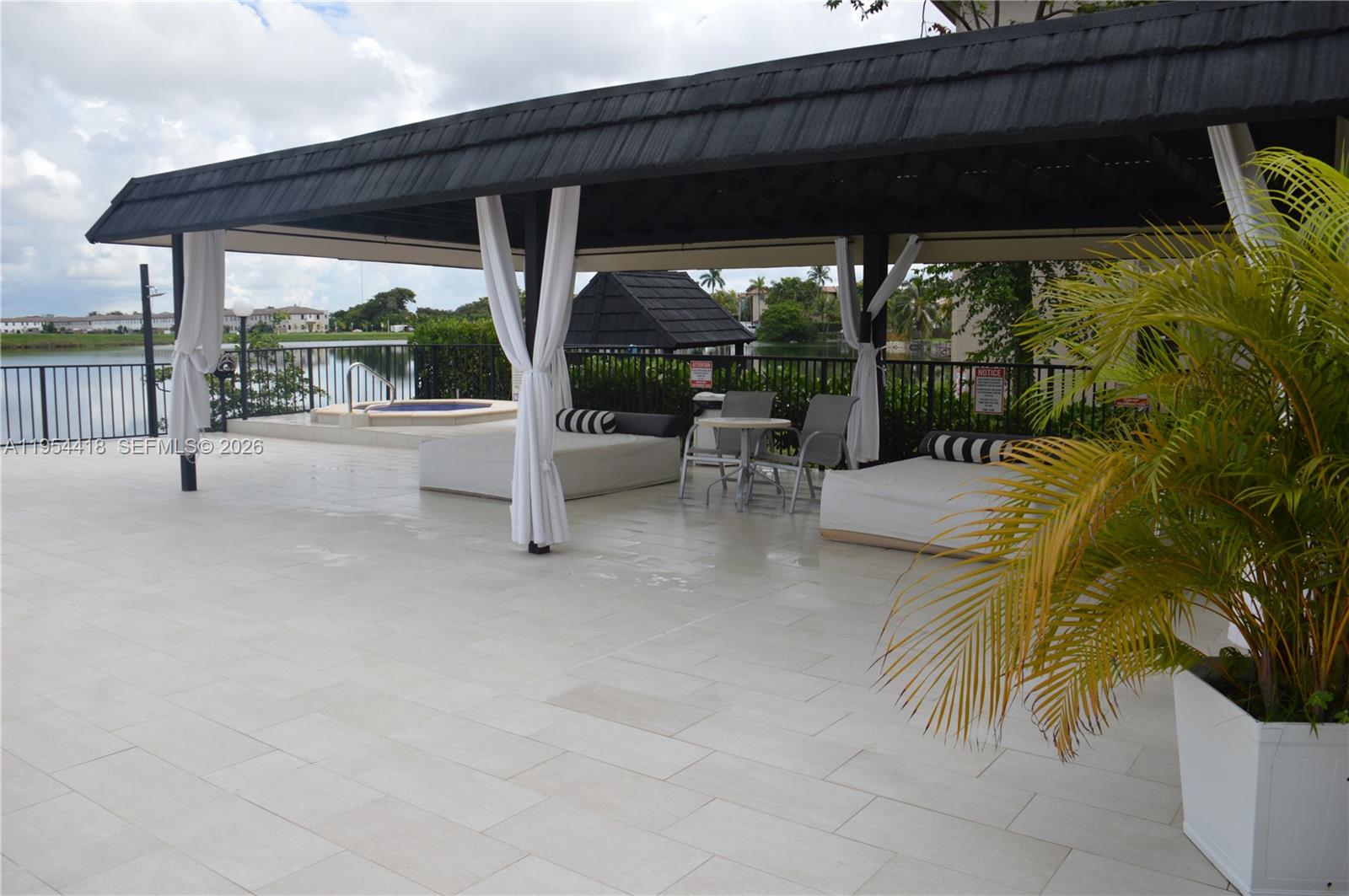 461 Ives Dairy Road, Unit 4042 Miami, FL 33179 - Photo 15 of 20 a view of a swimming pool with a patio