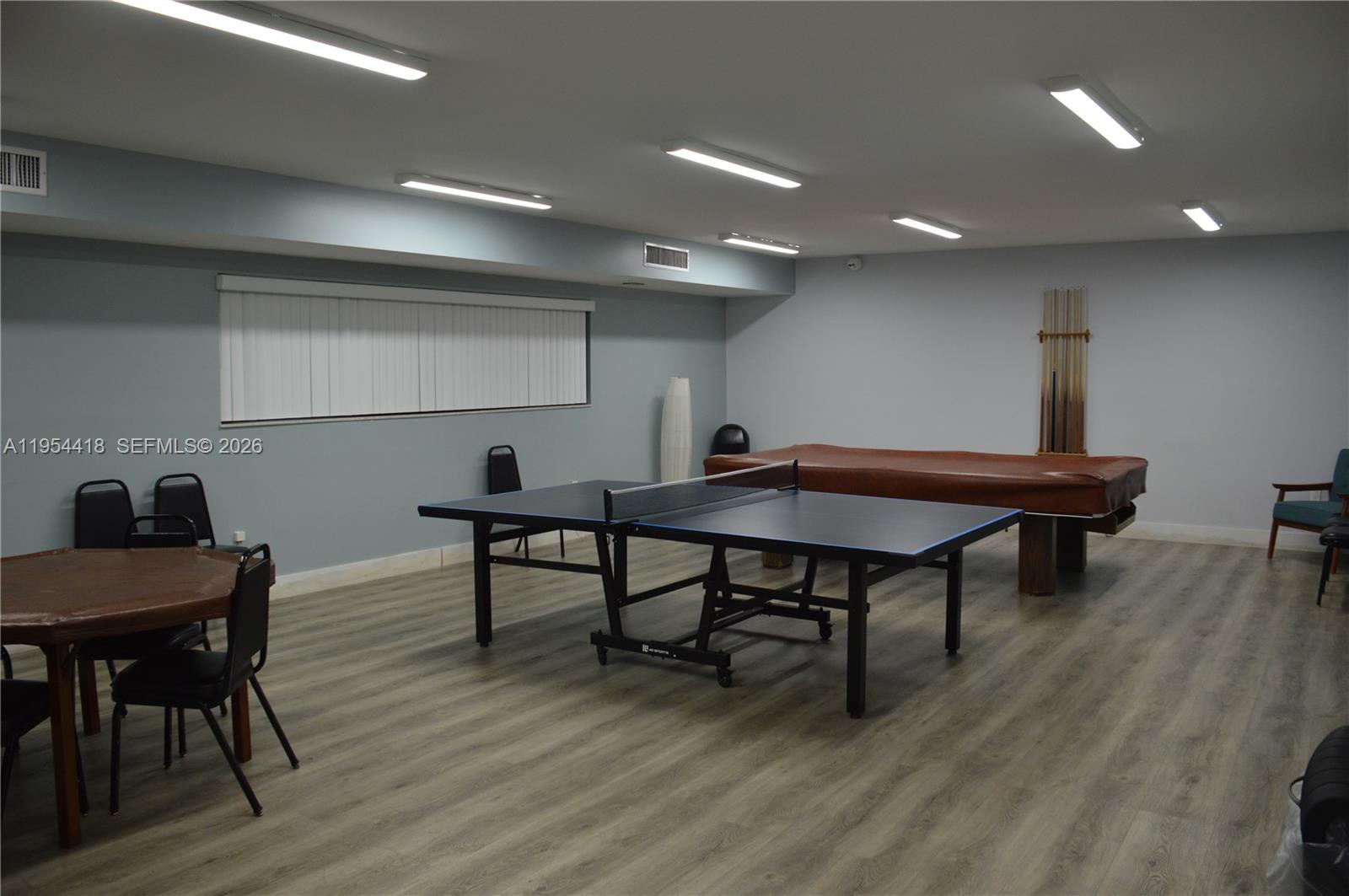 461 Ives Dairy Road, Unit 4042 Miami, FL 33179 - Photo 19 of 20 a view of a room with furniture and wooden floor