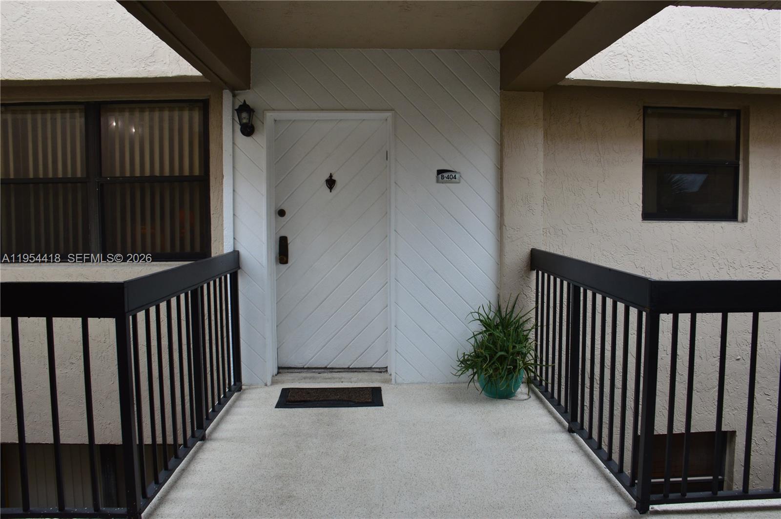 461 Ives Dairy Road, Unit 4042 Miami, FL 33179 - Photo 2 of 20 a view of a balcony with furniture