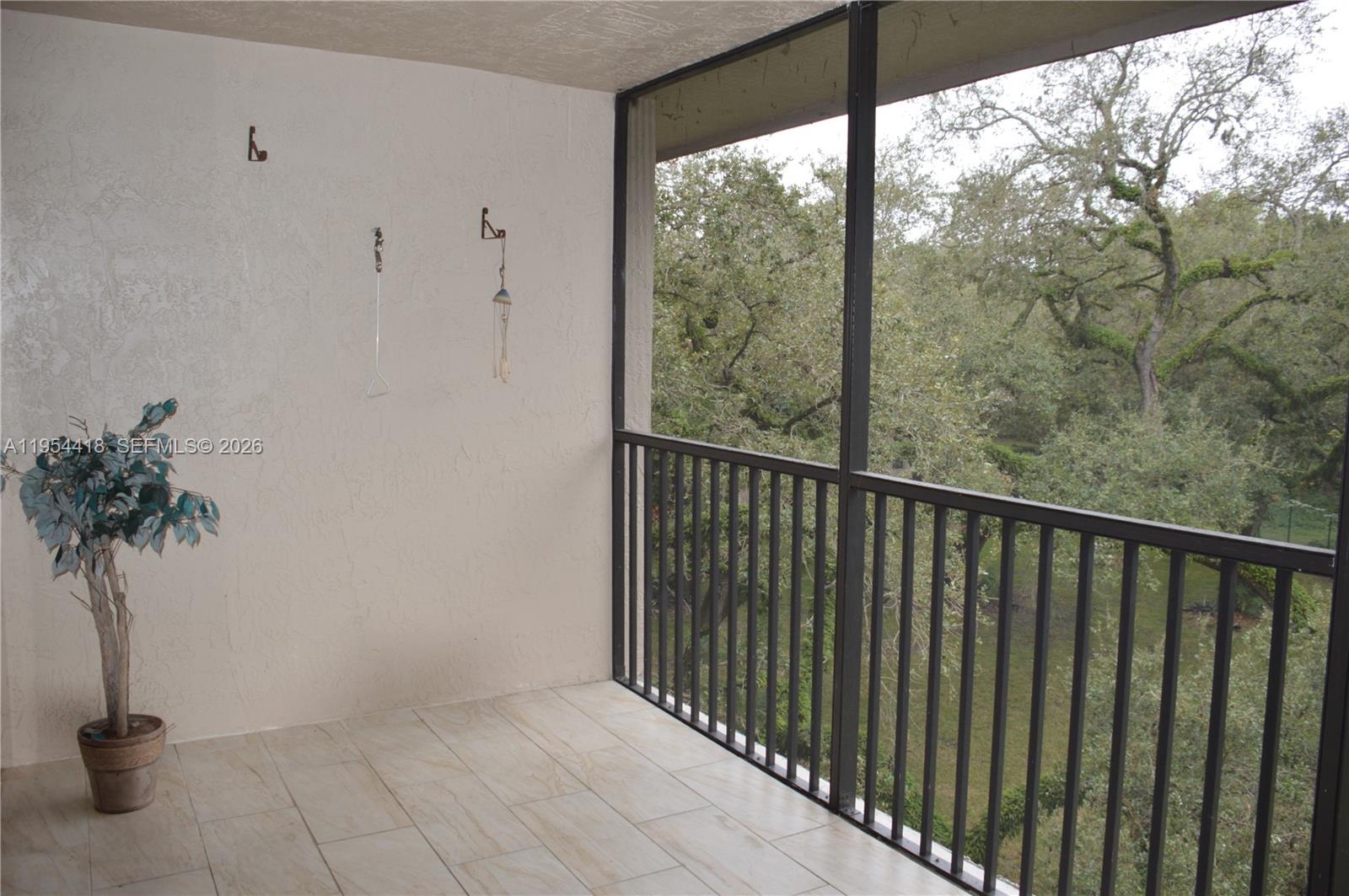 461 Ives Dairy Road, Unit 4042 Miami, FL 33179 - Photo 4 of 20 a view of a glass door with a balcony