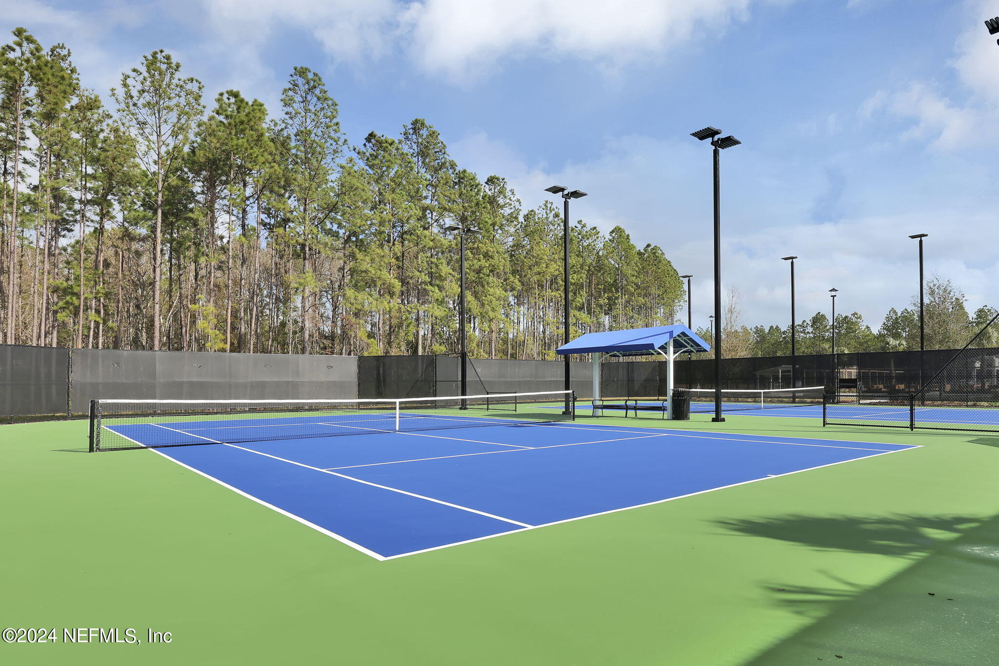 184 Continuum Loop Yulee, FL 32097 - Photo 16 of 22 a view of a tennis court