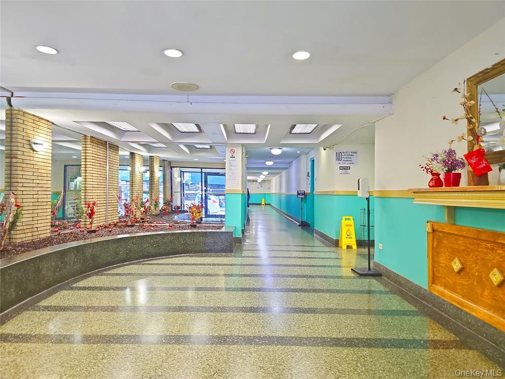 137-10 Franklin Avenue, Unit 415 Queens, NY 11355 - Photo 3 of 9 a view of a living room and kitchen