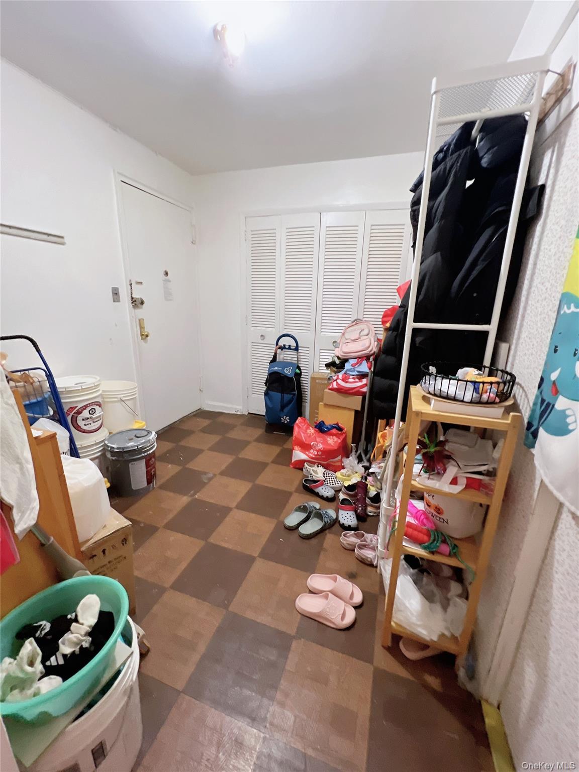 137-10 Franklin Avenue, Unit 415 Queens, NY 11355 - Photo 5 of 9 a bedroom with furniture and a wooden floor