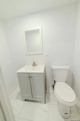 a view of a chairs and tables in the balcony