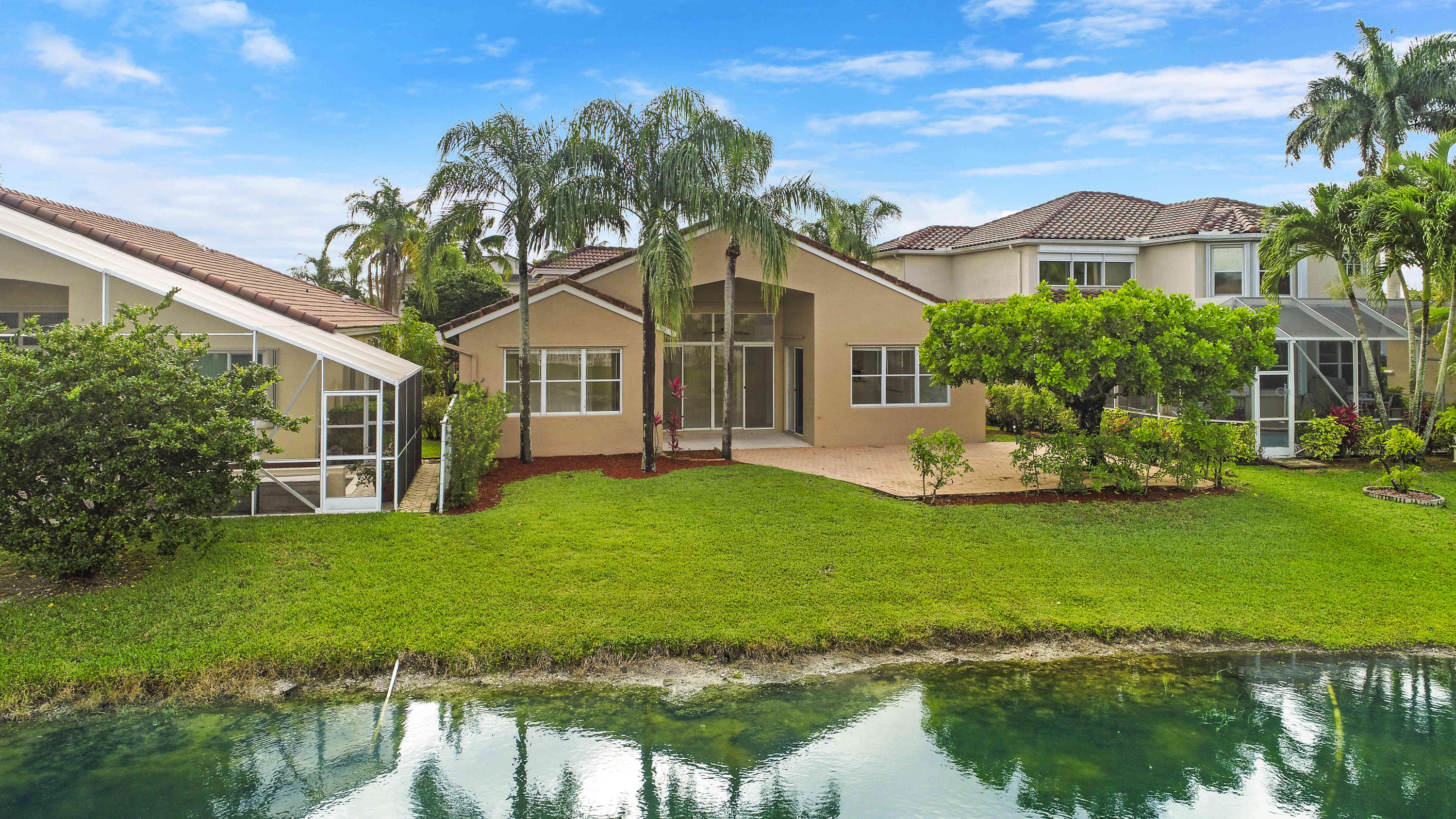 18705 Sea Turtle Lane Boca Raton, FL 33498 - Photo 2 of 27 Yard, Patio & Lake at rear