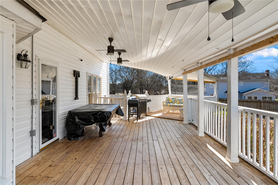 112 C-10-220 Anderson, SC 29621 - Photo 40 of 45 This spacious wooden deck with ceiling fans offers a perfect outdoor entertaining space.