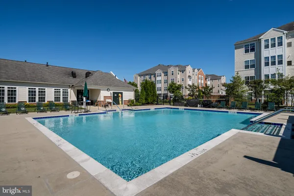 an aerial view of a house with yard swimming pool and outdoor seating
