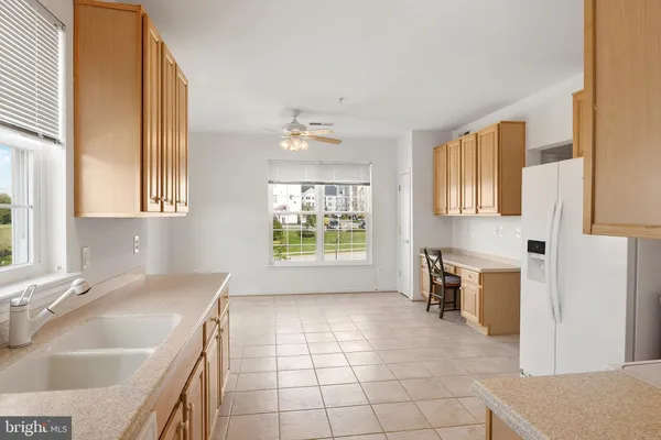 a kitchen with a sink and a stove top oven