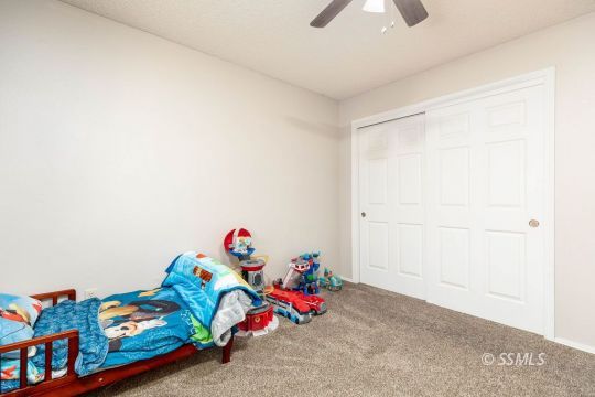 1004 Conejo Avenue Ridgecrest, CA 93555 - Photo 23 of 33 a bedroom with toys and dresser