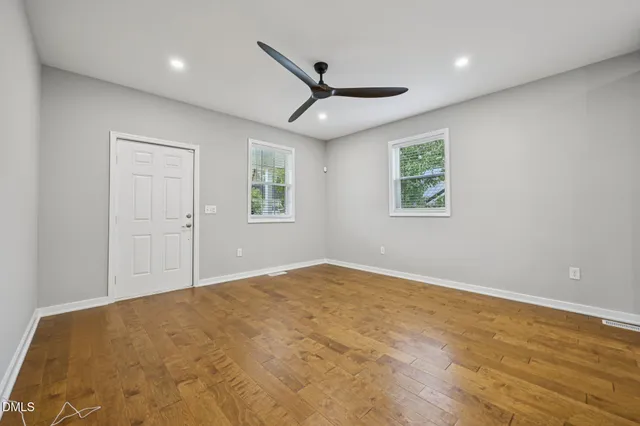 a view of a porch with wooden floor and stairs