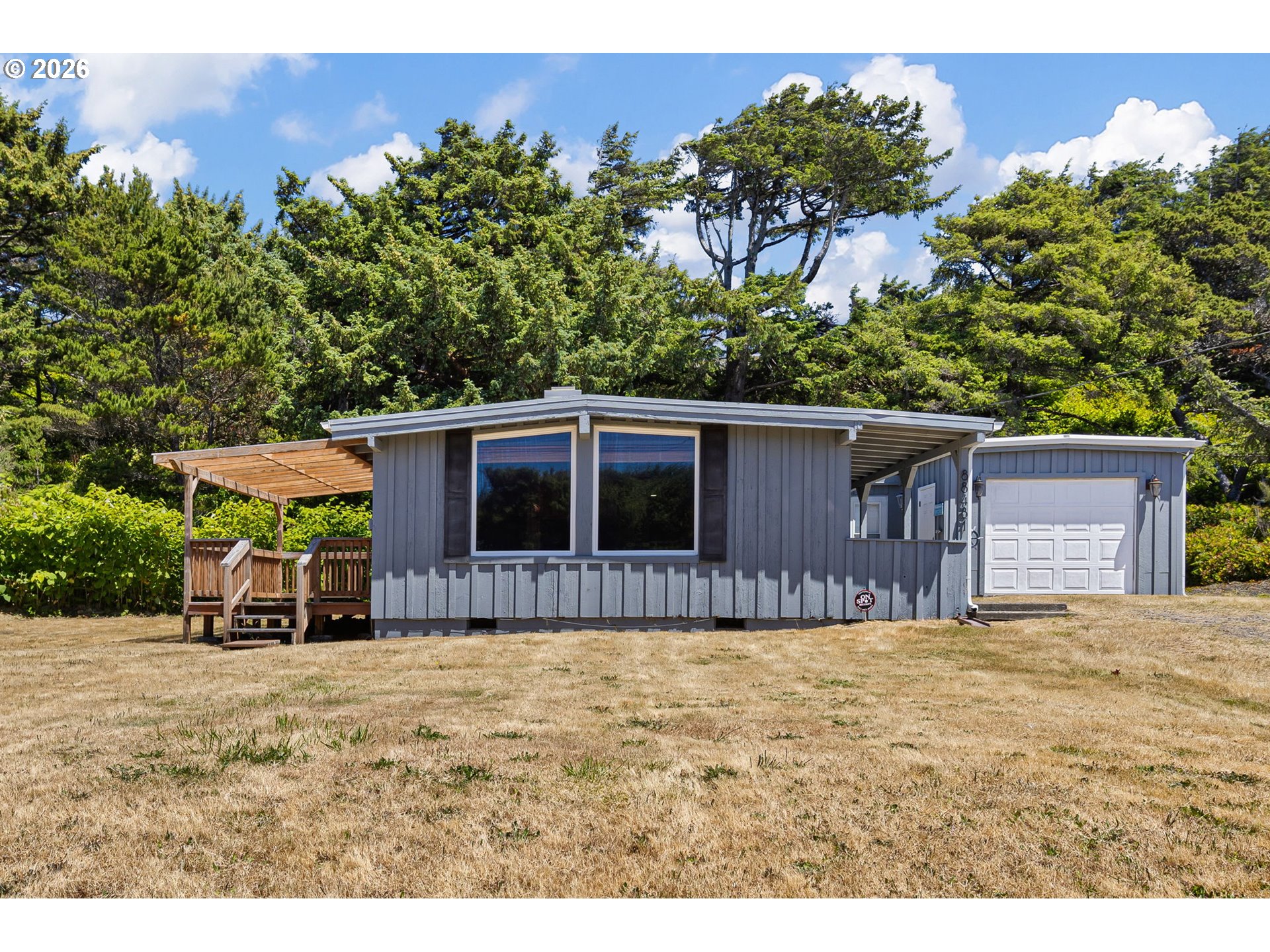 88481 1st Avenue Florence, OR 97439 - Photo 1 of 43 a house view with a sitting space and garden