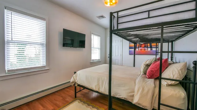 a bed room with a bed and a window