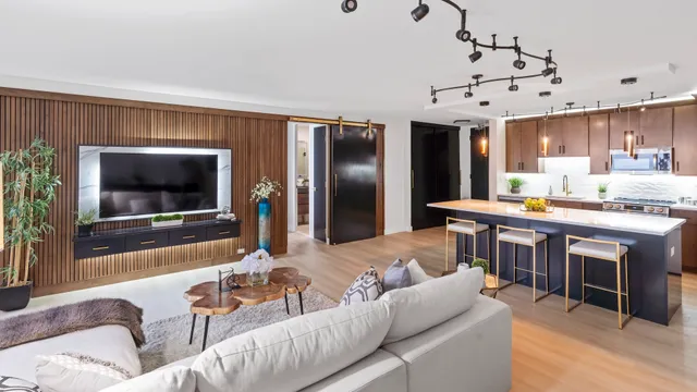 a living room with fireplace furniture and a flat screen tv