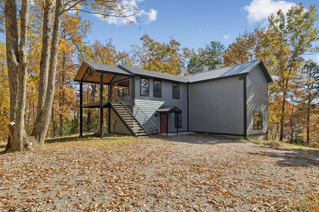 a view of a porch with wooden floor and windows