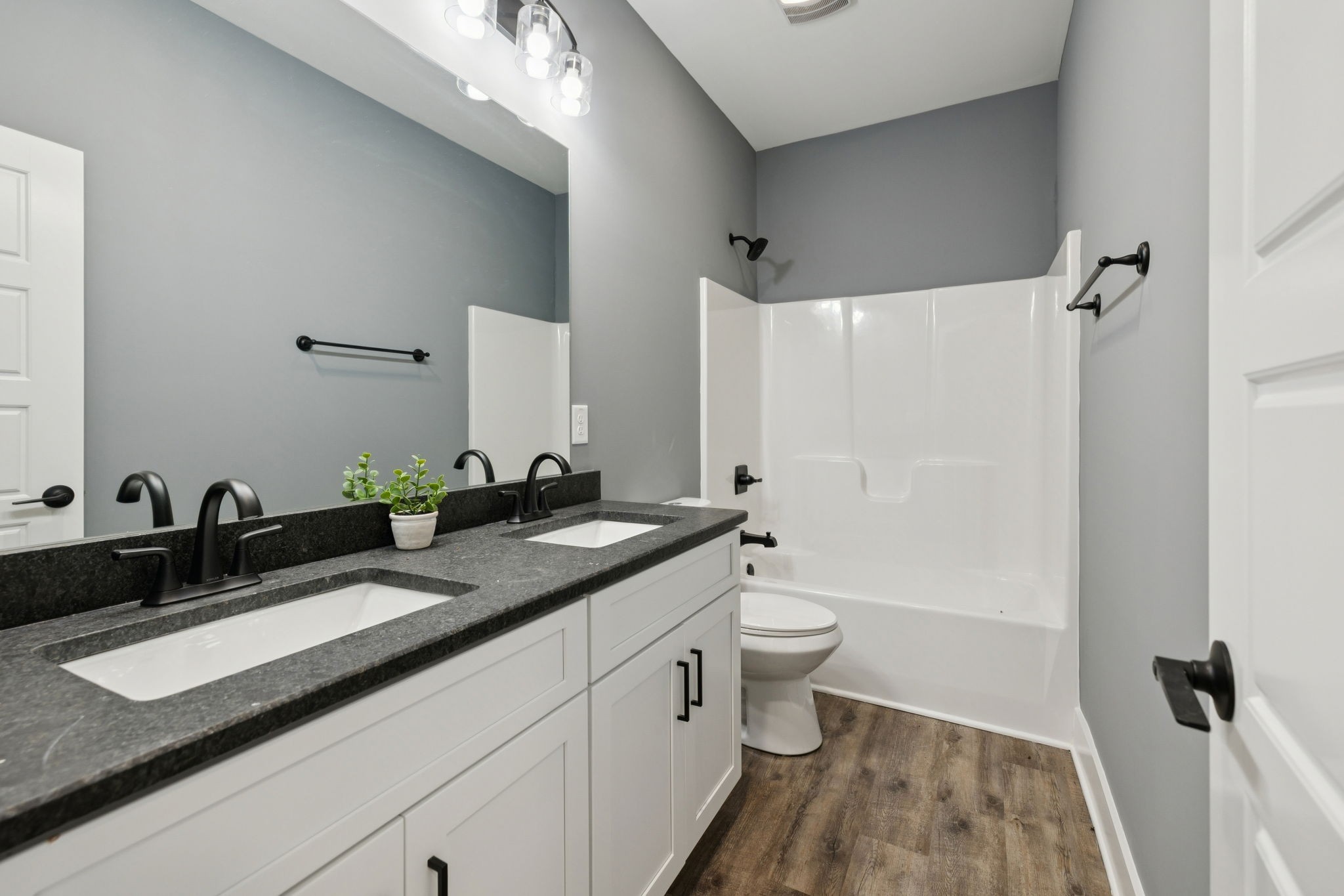 1529 Pea Ridge Road Liberty, TN 37095 - Photo 34 of 53 a bathroom with a granite countertop sink a toilet and a mirror