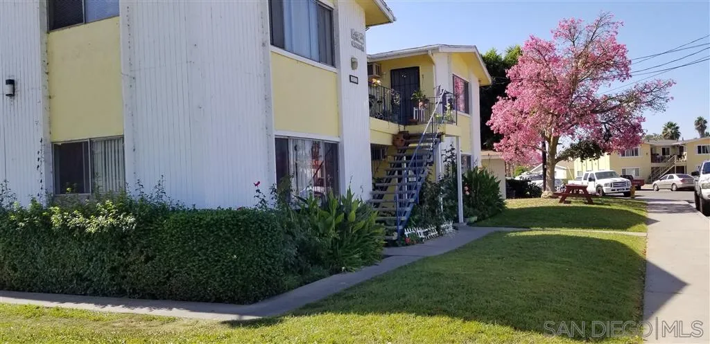 333 Lansing Circle Escondido, CA 92025 - Photo 2 of 18 a front view of a house with a yard fountain and a tree