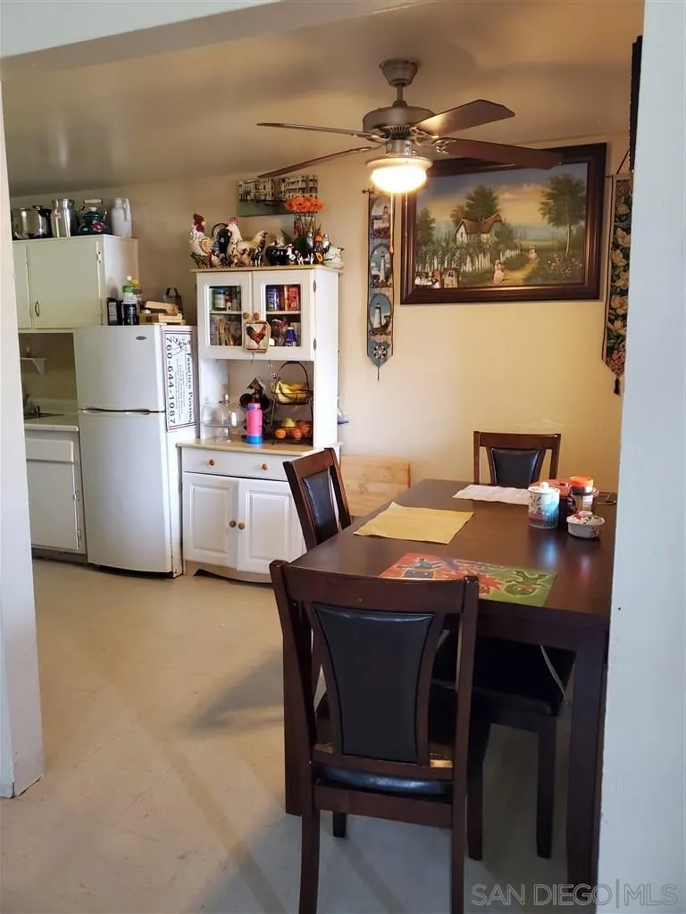 333 Lansing Circle Escondido, CA 92025 - Photo 4 of 18 a room with a table chairs and a refrigerator