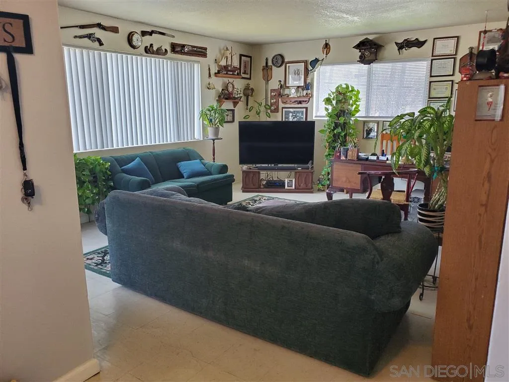 333 Lansing Circle Escondido, CA 92025 - Photo 8 of 18 a living room with furniture and a flat screen tv