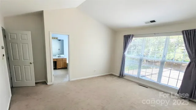 a view of a room with large windows