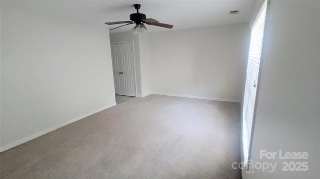 a view of empty room with windows