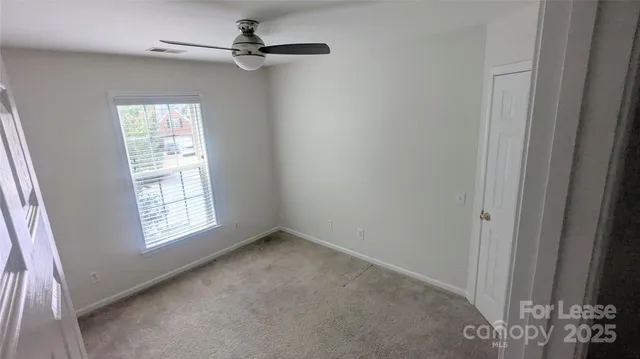 a view of empty room with windows