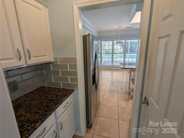 a bathroom with a shower and a mirror