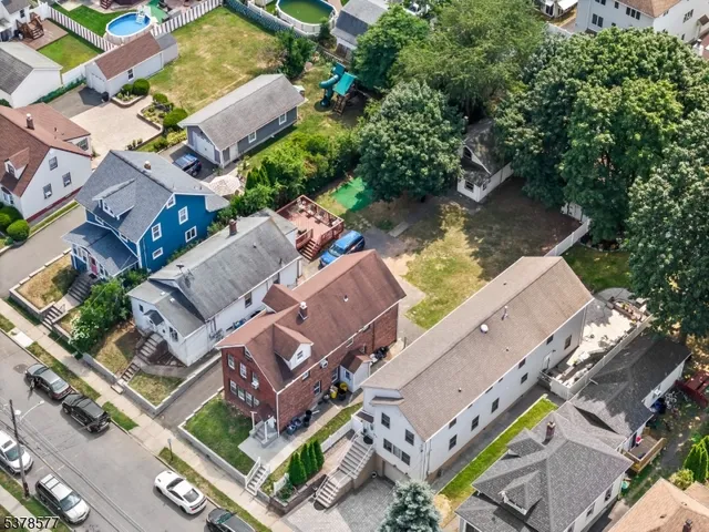 an aerial view of a house with a lake view