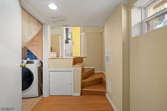 a bedroom with a bed and a large mirror