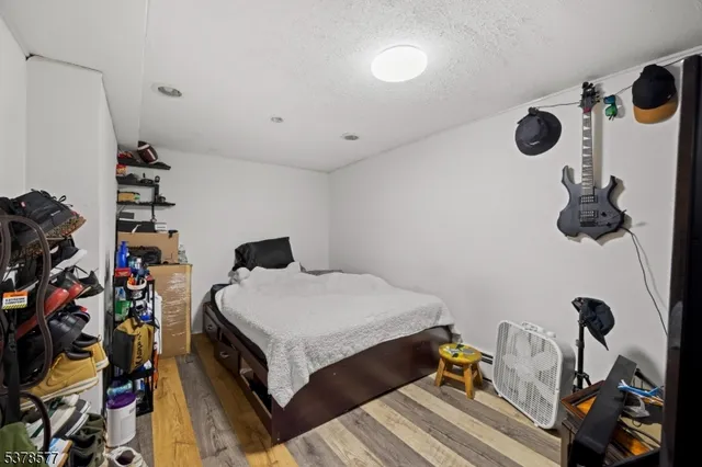 a view of a workspace with furniture and wooden floor