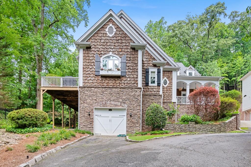 3395 Stillhouse Road Southeast Atlanta, GA 30339 - Photo 1 of 1 a front view of a house with a garden