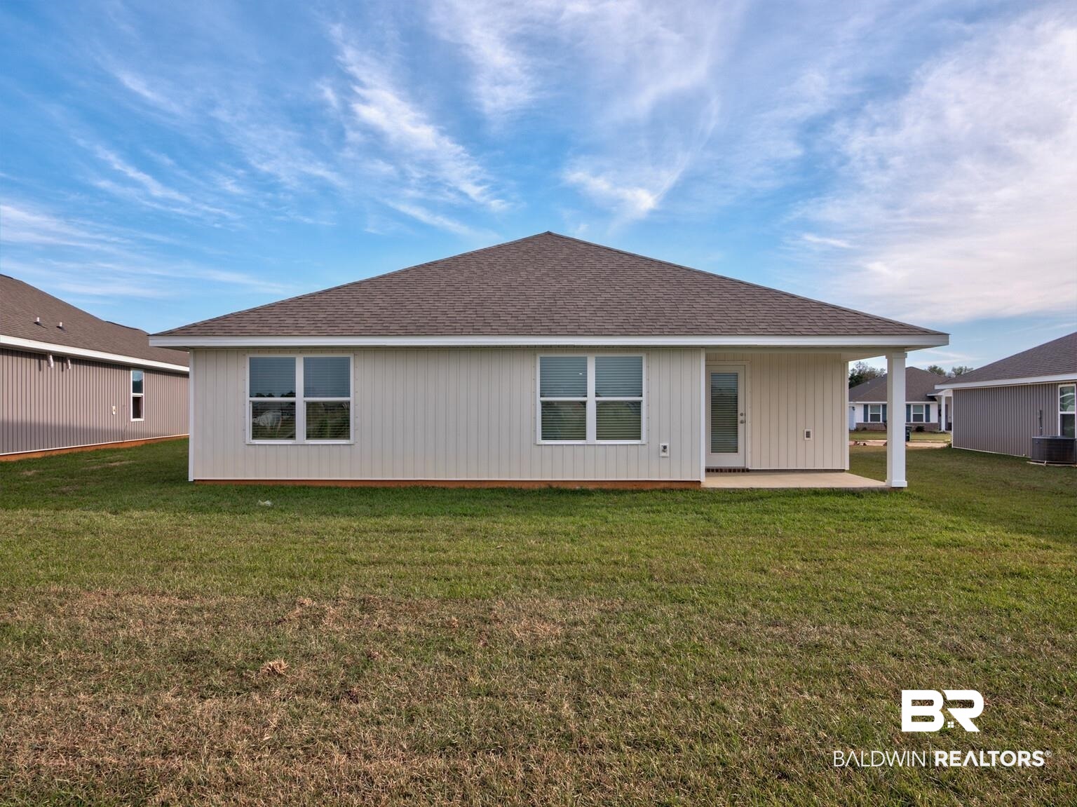 23952 Citation Loop Daphne, AL 36526 - Photo 5 of 69 Back of property featuring roof with shingles, a patio, and a yard